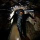 A Palestinian works inside a smuggling tunnel flooded by Egyptian forces, beneath the Egyptian-Gaza border in Rafah, in the southern Gaza Strip February 19, 2013.
